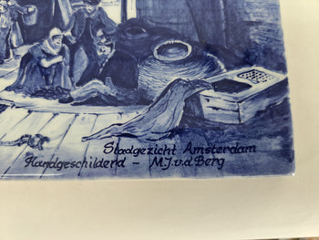 Detail of a delftblue plaque depicting view on old Amsterdam