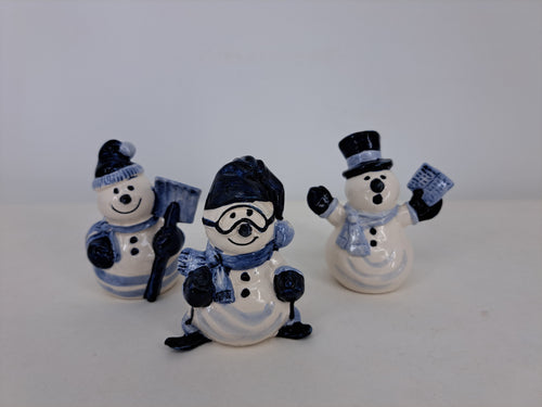 Set of three funny delftblue snowmen.