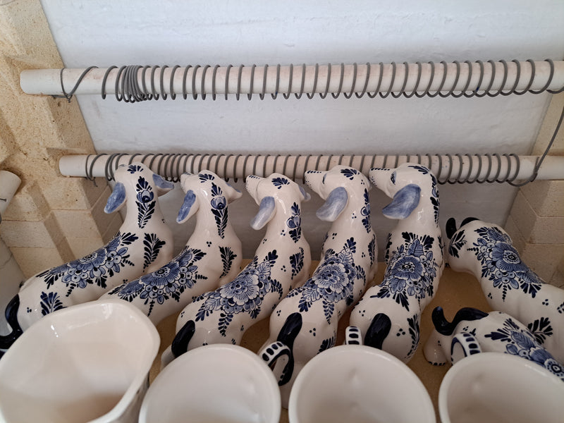 Serie of ceramic blue dachshunds in our ceramic kiln.
