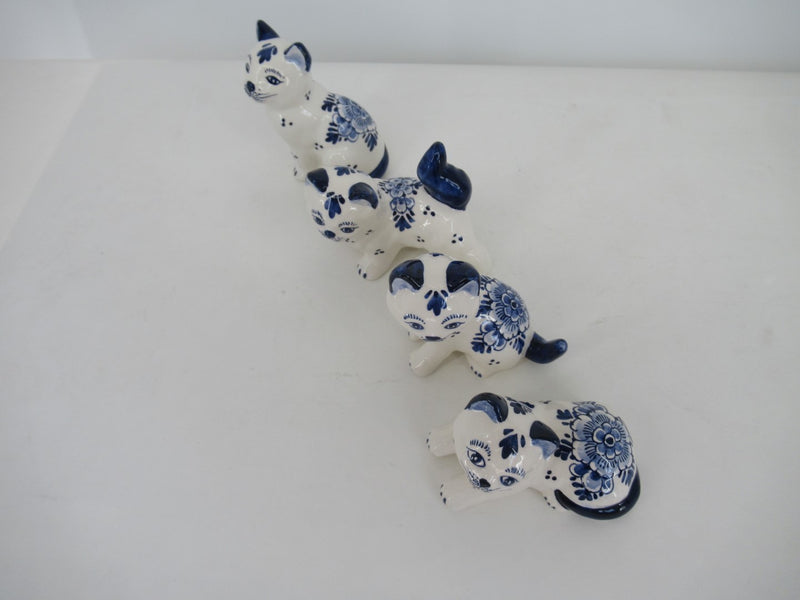 line of 4 different handpainted delftblue kittens.