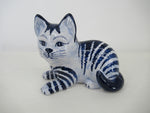 sitting delftblue striped cat.