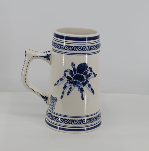 Giant beerstein with a spider painted on.