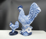 large and small ceramic delftblue painted roosters.