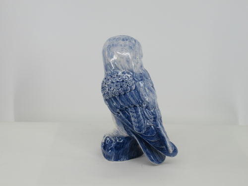 Ceramic owl painted to life in blue.