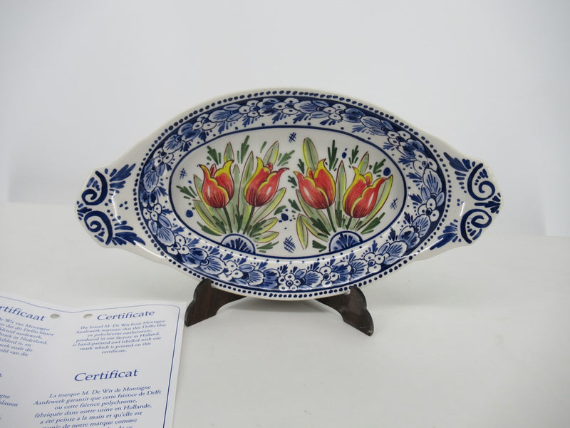 oval ceramic dish with red tulips.