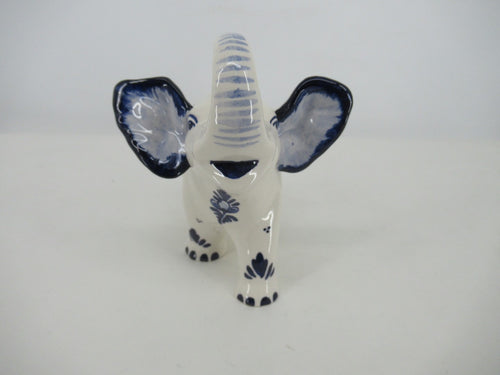 front view of a delftblue elephant figurine showing its big ears.