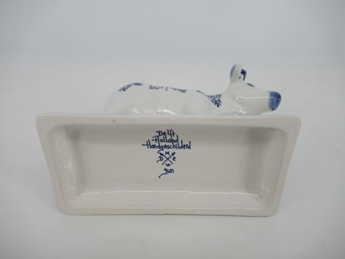 bottom with Delft marking of a handpainted ceramic cow on a stand