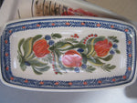 Rectangle ceramic cakedish with a pattern of handpainted red tulips.