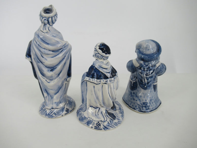 three handpainted ceramic wise men seen from behind