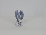 delft ceramic christmas angel reading the book