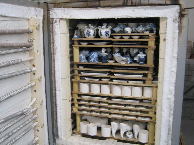 view of a fully loaded ceramic kiln that has been opened after firing.