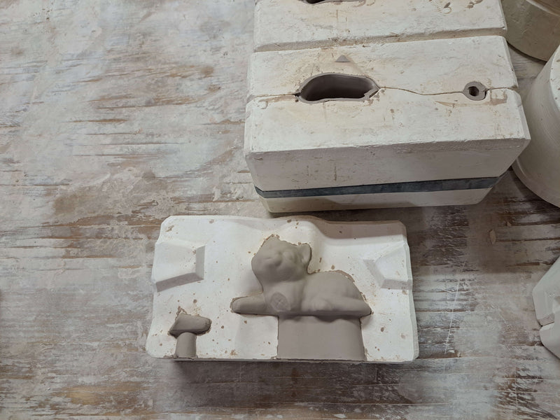  ceramic clay cat, still in its mold after being slipcasted.