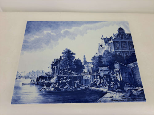 Delftblue wall plaque depicting an Amsterdam 17th century city view.