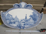 Picture of a large delftware plaque with a 19th centurt Dutch village scene from Cornelis Springer.