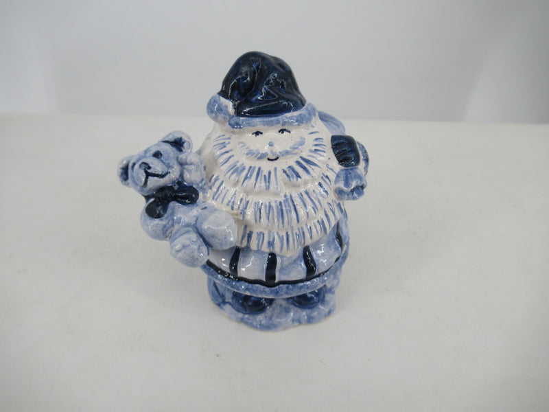 Delftblue Santa holding a childrens toy (train)