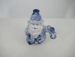 Delftblue Santa holding a childrens toy (train)