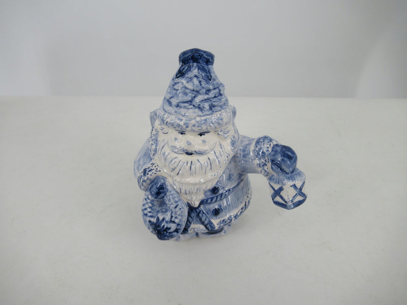 Delftblue Santa holding a childrens toy (train)