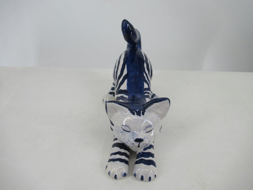 delft blue stretching cat