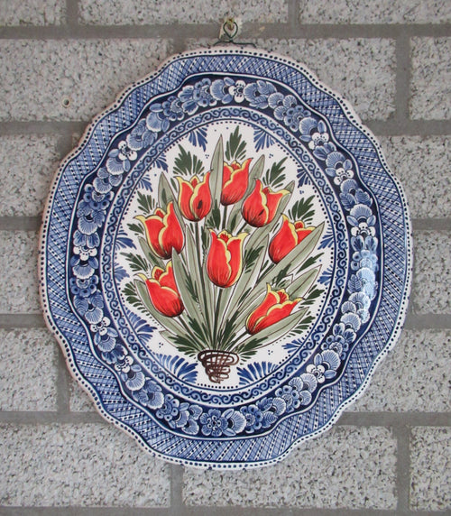 ceramic wall mural with a handpainted red tulip bouquet in a delftblue design