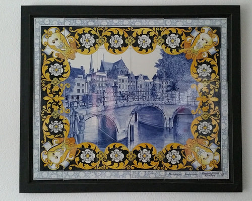 Framed handpainted Delftblue tilepanel depicting Dutch canal view with multicolor floral border