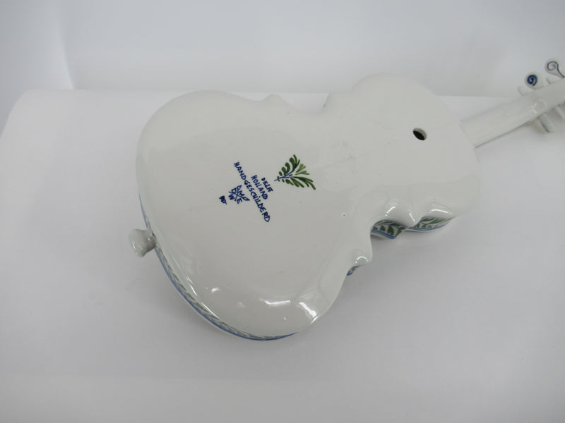 back view of a Delft polychrome ceramic violin with pottery marking