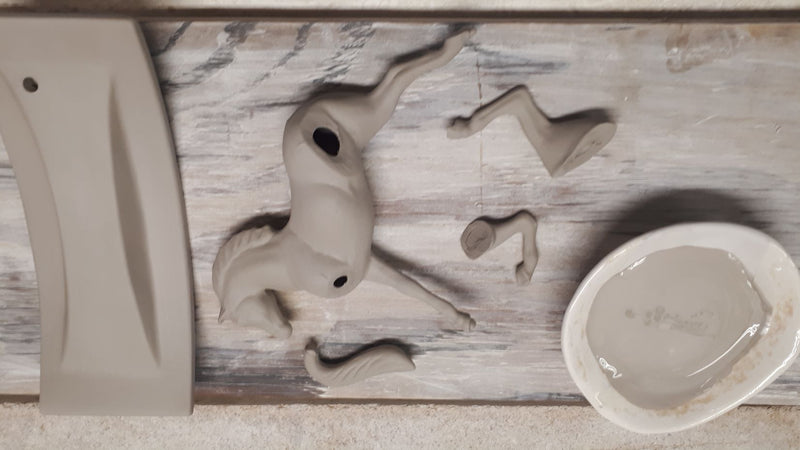 still unfired greenware clay in the shape of a horse