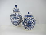 two sizes of handpainted delft cookie jars.