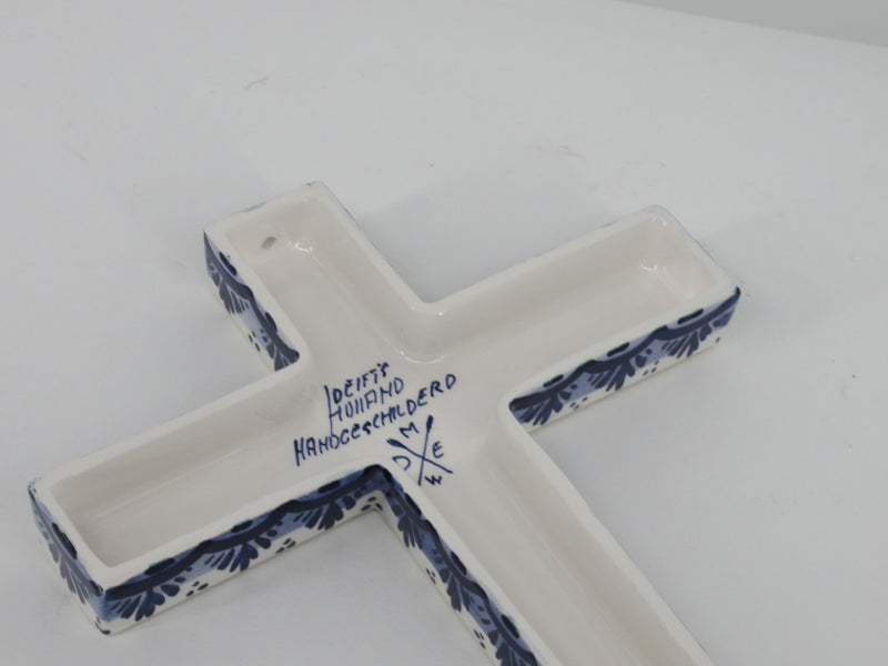 back side of a Delft ceramic wall crucifix showing brandmark and painters signature