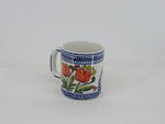 coffee mug with a red tulip bouquet in a delftblue design
