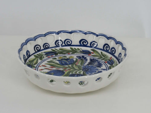 open delftblue ceramic dish with a bouquet of blue tulips at the centre