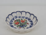 open ceramic dish with a bouquet of red tulips handpainted in the middle