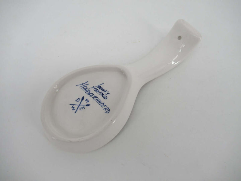 bottomview with brand name and delftpainters signature of a ceramic spoonrest.