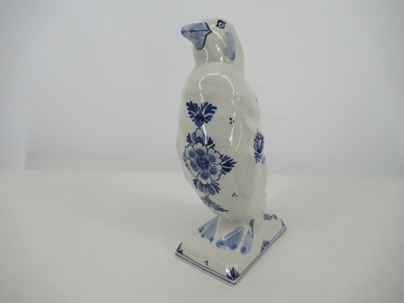 Handpainted delftblue ceramic penguin with a floral design