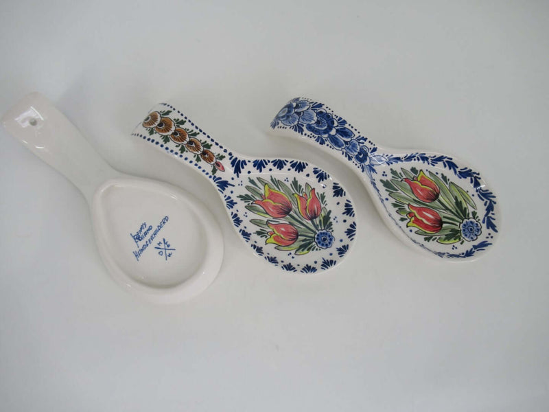 ceramic spoonrests of which one shows its brand sign