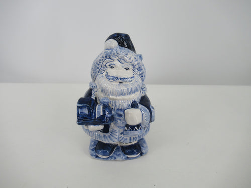 Delft ceramic Santa holding a toy train
