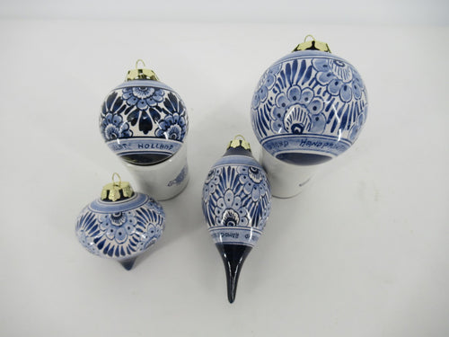 set of 4 shapes of delftblue Christmas baubles in same floral design