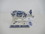 delftblue handpainted ceramic cow on a stand
