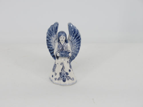 delft ceramic christmas angel playing harmonica