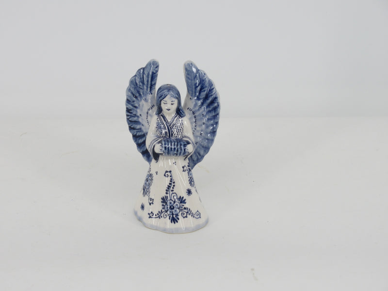 delft ceramic christmas angel playing harmonica