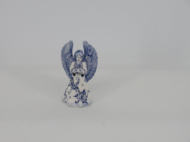 delft ceramic christmas angel reading the book